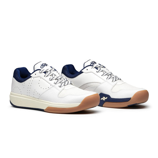 Men's pickleball shoes by DAPS DESI, pair in white with navy accents and tan gum soles