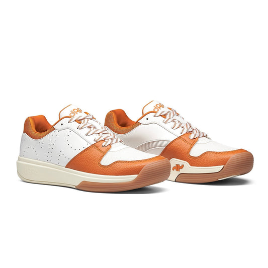 Pair of DAPS DESI low pickleball shoes, white uppers with burnt orange panels