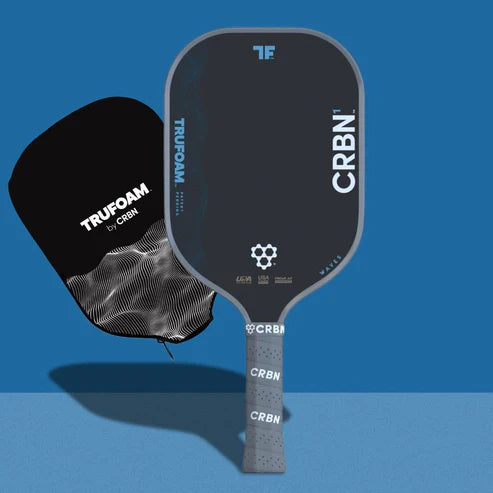 Dark pickleball paddle with textured grip and CRBN logo on the face