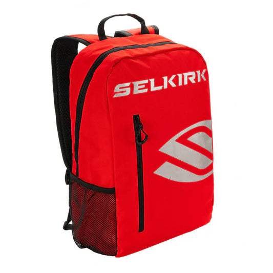 Red Selkirk pickleball day bag backpack with black trim, side mesh pocket, top handle