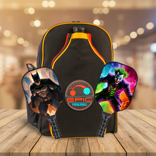Black pickleball backpack with orange trim and Joker-themed paddle graphics on front