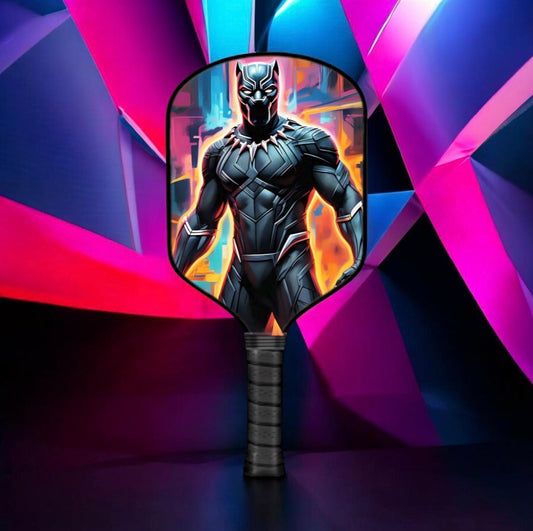 Pickleball paddle with Black Panther style character face graphic and black grip handle