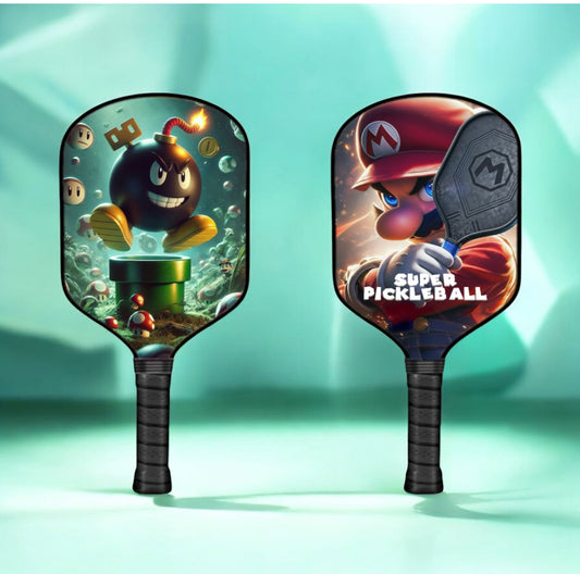 Pickleball paddle with black grip, green-and-brown character artwork on face