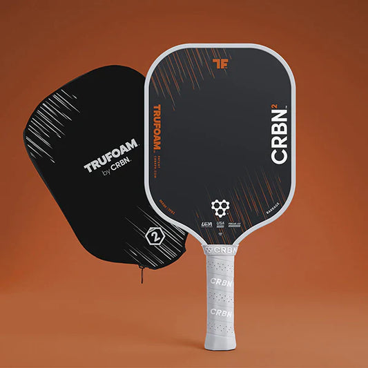 Pickleball paddle with black face and white handle, showing CRBN TruFoam lettering