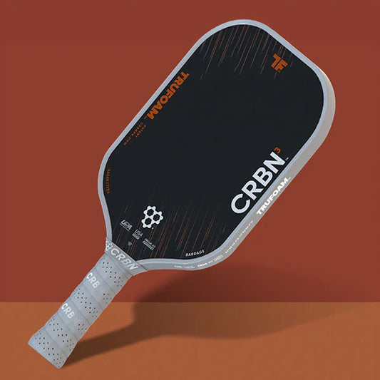 Elongated pickleball paddle with black face and perforated light gray grip