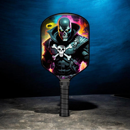 Pickleball paddle with skull and flame graphic face, black grip handle