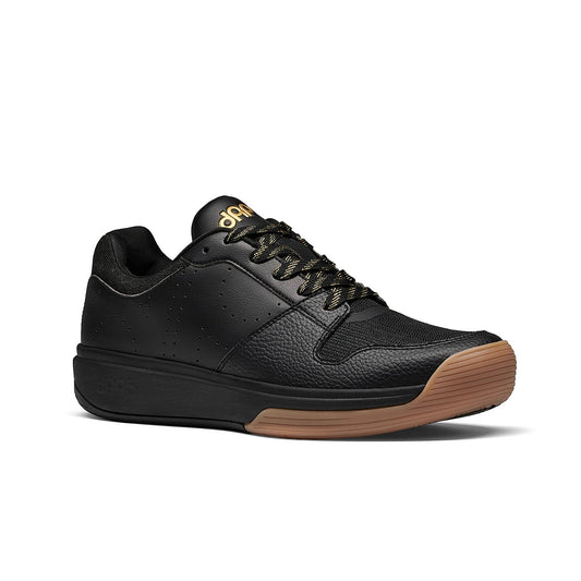 Women's black low-top pickleball shoes with lace-up front and gum rubber sole