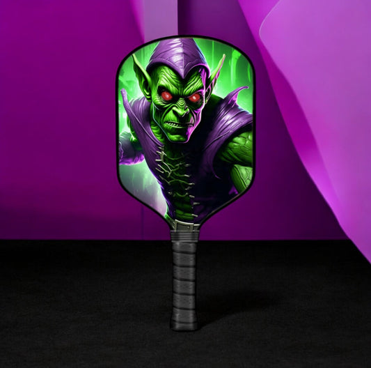 Green Goblin pickleball paddle with colorful character face and dark grip