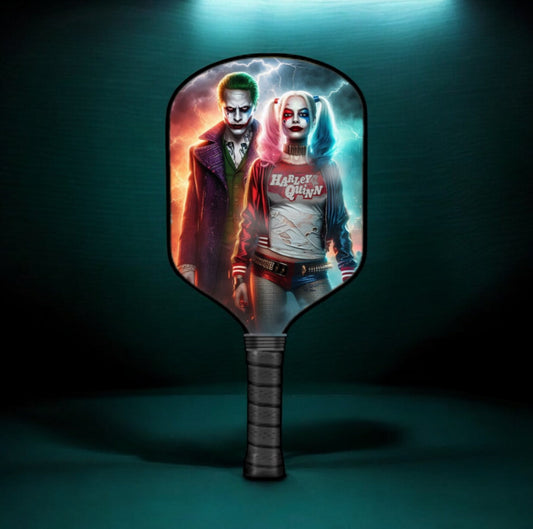 Pickleball paddle with circular fantasy character graphic and dark textured handle