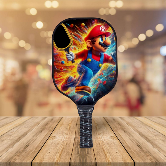 Mario-themed pickleball paddle with rounded black head and colorful character artwork.