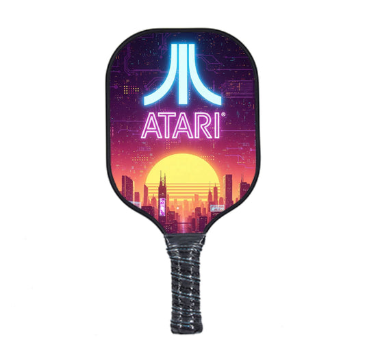 Neon Atari pickleball paddle with purple city design and textured black grip