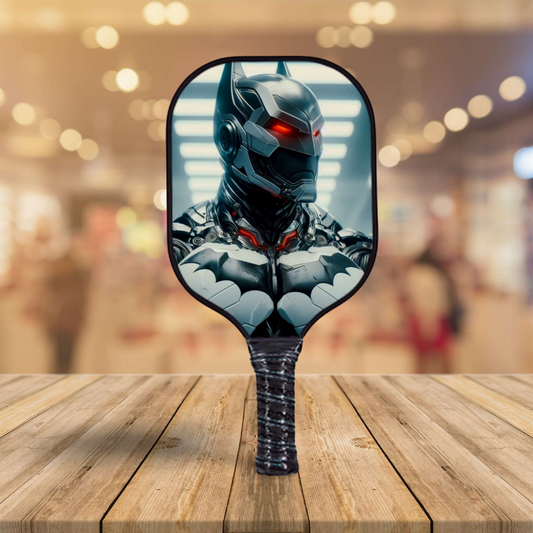 Batman-themed pickleball paddle with black-and-gray character face