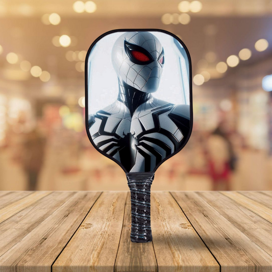 Black and white Spider-Man themed pickleball paddle with red eye graphic
