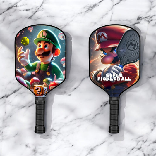 Luigi-themed pickleball paddle with Luigi face graphic and black handle.