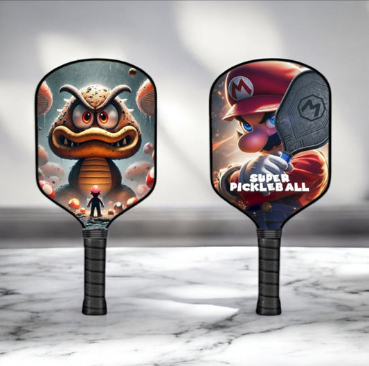 Pickleball paddle with Goomba character graphic and black grip handle, pair shown