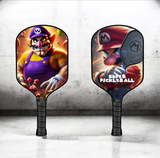 Pickleball paddle with purple-and-red cartoon character graphic on both faces
