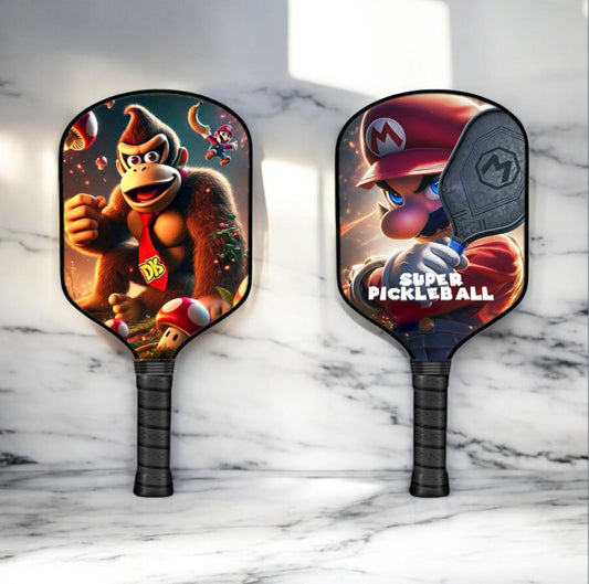 Two pickleball paddles with Donkey Kong and Mario character graphics, dark grip