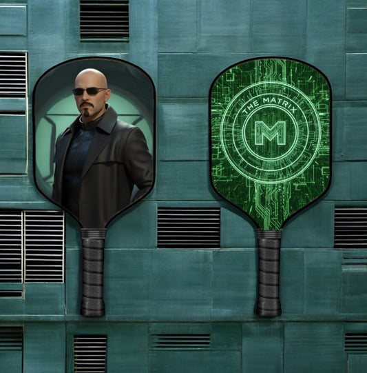 Two pickleball paddles with black grips and green Matrix-style face graphics