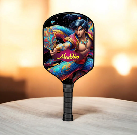 Aladdin-themed pickleball paddle with colorful artwork and black grip handle