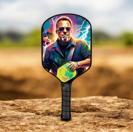 Pickleball paddle with colorful face graphic and black handle