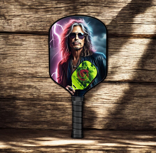 Pickleball paddle with colorful character graphic and dark grip handle.