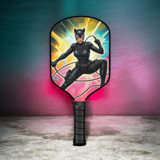 Pickleball paddle with Cat Woman graphic and black grip handle