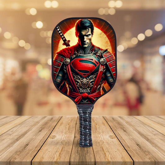 Superman-themed pickleball paddle with round face and long grip