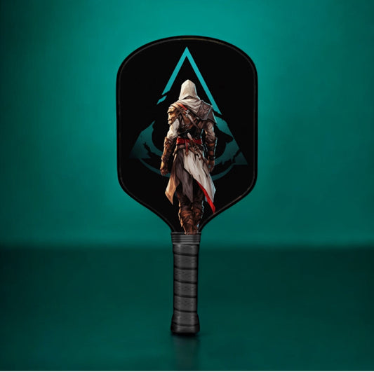Black pickleball paddle with Assassin Creed artwork and textured grip handle