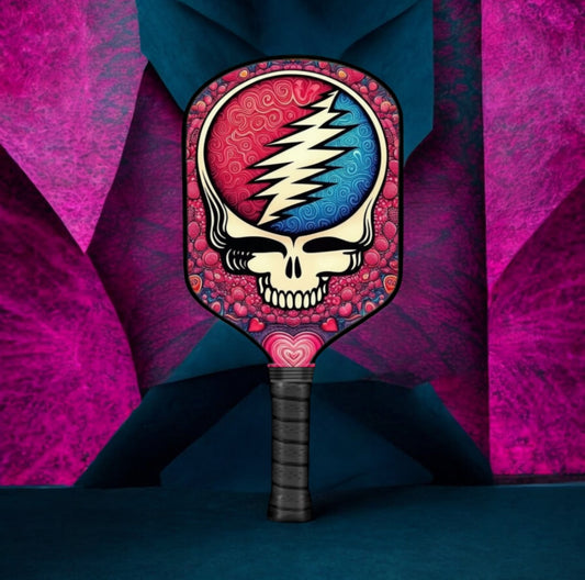 Pickleball paddle with black handle and circular skull lightning graphic face