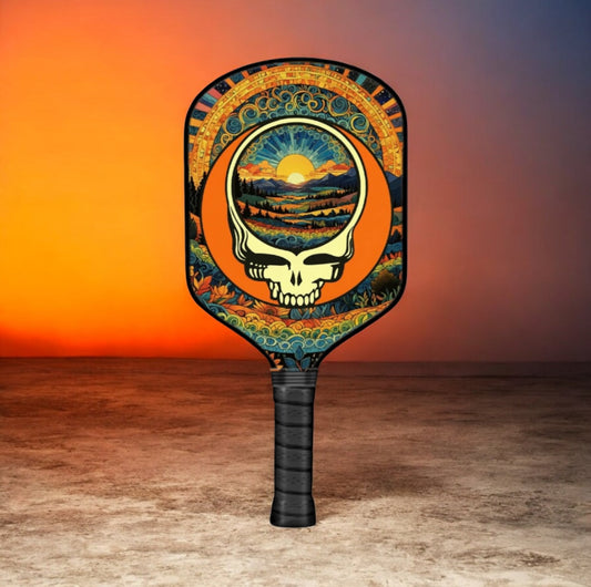 Pickleball paddle with circular skull sunset Stealie graphic and black grip