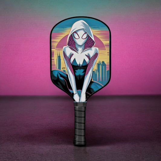 Pickleball paddle with black handle and white-blue character graphic on oval face