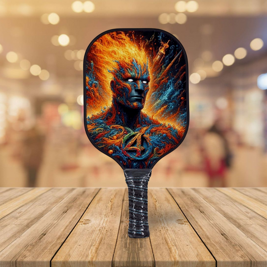 Pickleball paddle with fiery blue character artwork on a black paddle face