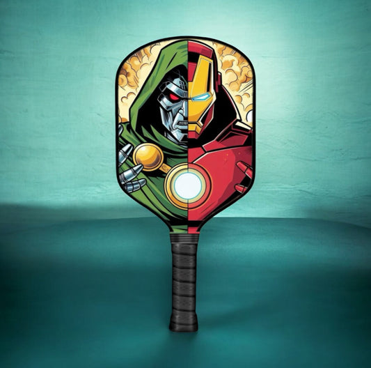 Pickleball paddle with colorful character face graphic and dark grip handle