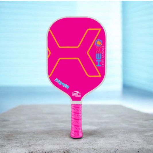 Pink STRYKER pickleball paddle with hex graphic and textured pink grip