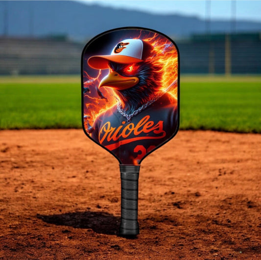 Baltimore Orioles pickleball paddle with flame bird logo; black handle and red face