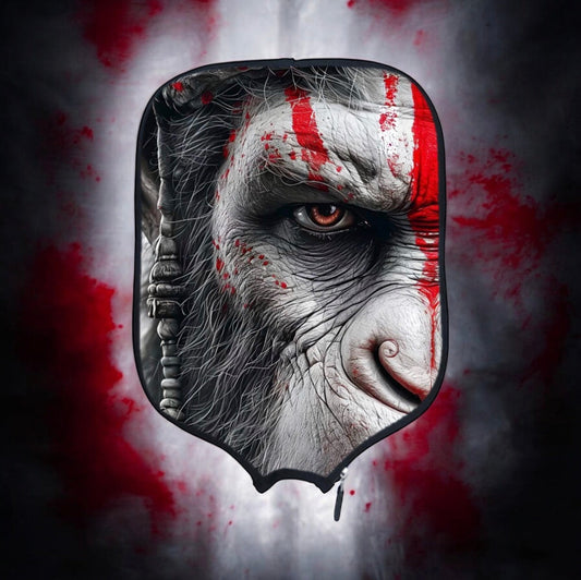 Pickleball paddle cover with black-and-white ape face graphic and red splatter