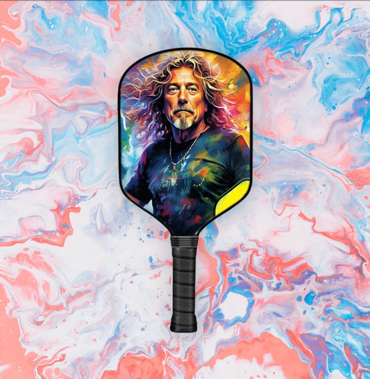 Pickleball paddle with colorful player graphic face and black textured handle