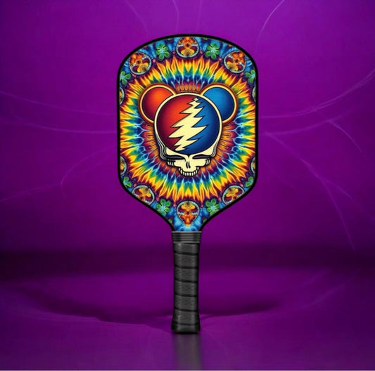 Black pickleball paddle with colorful bear Stealie graphic on rounded face.