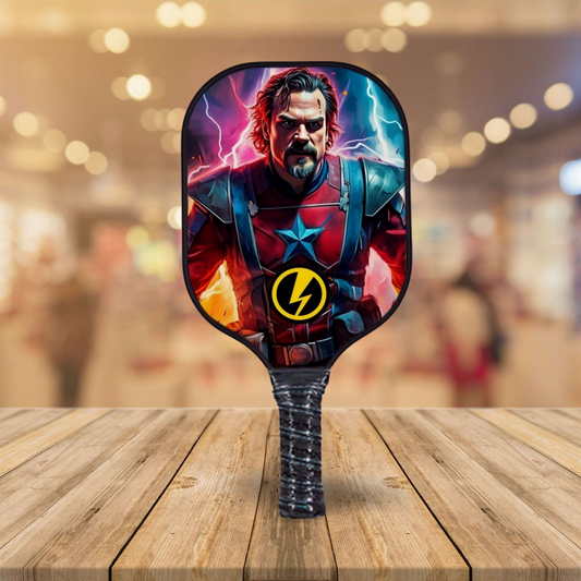 Pickleball paddle with colorful character face and lightning emblem on black edge