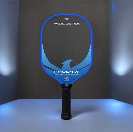 Pickleball paddle with blue frame and dark graphite face, black textured handle