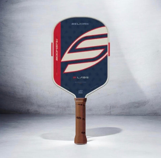 Elongated pickleball paddle with dark blue face and red-and-white swoosh graphic