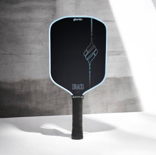 Hybrid pickleball paddle with black face, light blue edge, and line-art logo