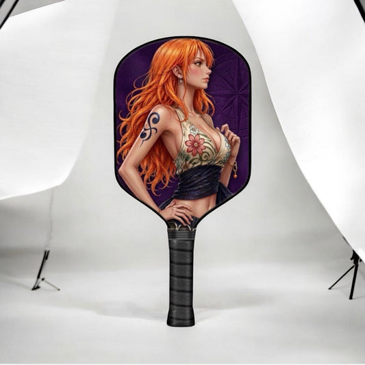 Pickleball paddle with red-haired anime character artwork and dark grip handle