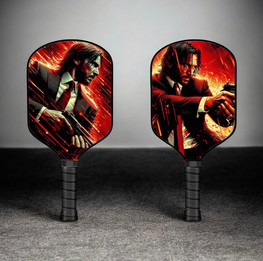 Red pickleball paddle with black handle and male character graphic, set of two