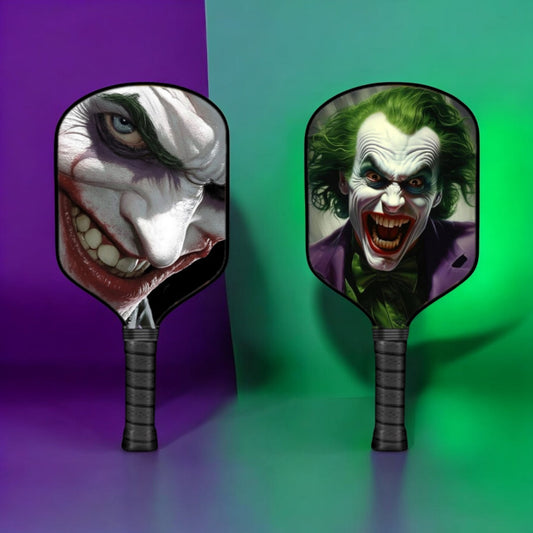 Joker-themed pickleball paddle with grinning clown face graphic on the paddle face