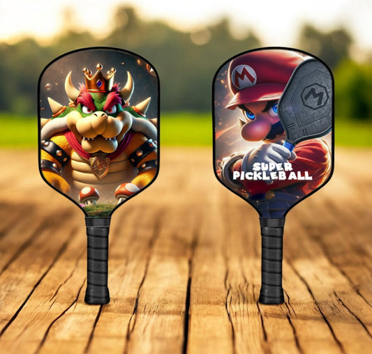 Bowser-themed pickleball paddle with colorful character artwork and black grip