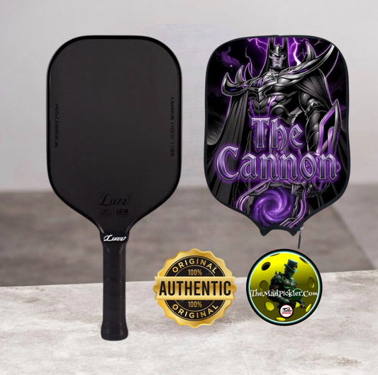 Pickleball paddle with purple black “cannon” face, plus matching black cover and badges