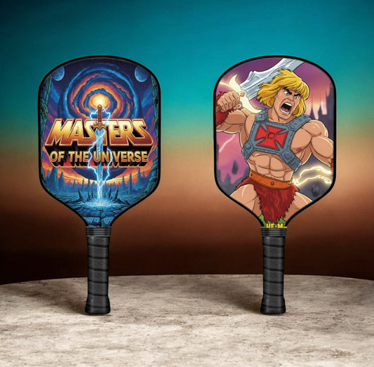 He-Man themed pickleball paddle with colorful character face and black handle