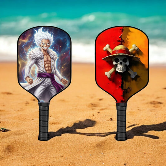 Two pickleball paddles with colorful character faces and black grips