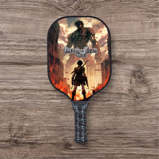 Printed pickleball paddle with dark frame, character artwork, and textured grip